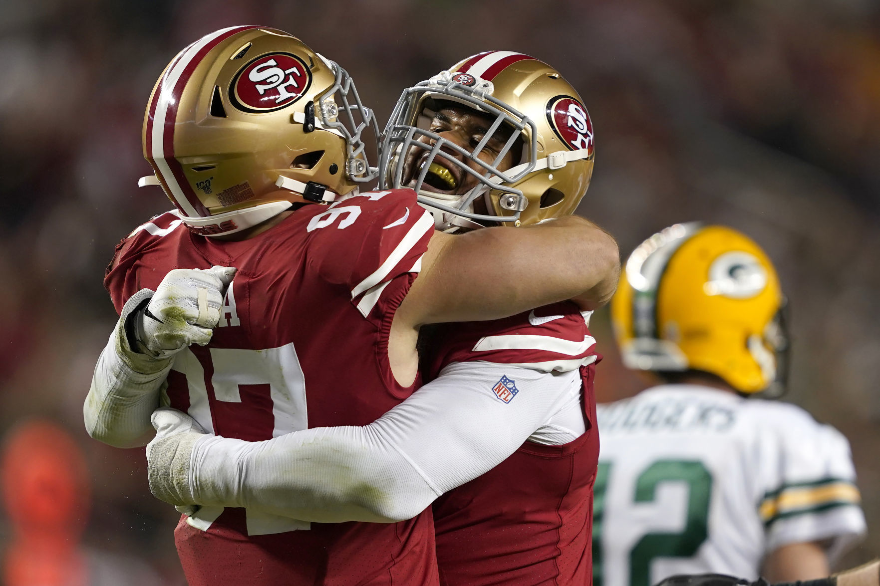 Arik Armstead, Nick Bosa, Aaron Rodgers, AP photo